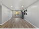Bright living room featuring laminate floors, neutral paint, and recessed lighting at 1085 Victor St, Aurora, CO 80011