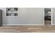 Living room featuring modern wood floors and gray walls at 1085 Victor St, Aurora, CO 80011