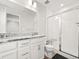 Bright bathroom featuring granite counters, white cabinetry, and a glass-enclosed tiled shower at 13754 Ash Cir, Thornton, CO 80602