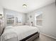 Bright, carpeted bedroom featuring multiple windows letting in plenty of light at 13754 Ash Cir, Thornton, CO 80602