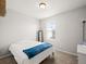 Bright bedroom featuring neutral walls, carpet, and a window letting in natural light at 13754 Ash Cir, Thornton, CO 80602