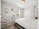 Neutral bedroom with closet doors, carpet, and a window providing natural light at 13754 Ash Cir, Thornton, CO 80602
