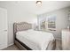 Well lit bedroom with neutral walls and carpet, featuring multiple windows at 13754 Ash Cir, Thornton, CO 80602