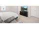 Relaxing bedroom featuring carpet, a television, and comfortable seating at 13754 Ash Cir, Thornton, CO 80602