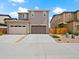 Exterior view of a modern two-story home with a three-car garage and a concrete driveway at 13754 Ash Cir, Thornton, CO 80602