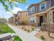 Street view of modern townhomes with landscaped front yards and inviting curb appeal at 13754 Ash Cir, Thornton, CO 80602