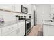 Modern kitchen with white cabinets, granite countertops, stainless steel appliances, and subway tile backsplash at 13754 Ash Cir, Thornton, CO 80602