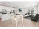 Inviting living space featuring an open kitchen, dining area, and comfortable seating at 13754 Ash Cir, Thornton, CO 80602