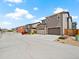 Street view of multiple modern two-story homes with driveways and garages at 13754 Ash Cir, Thornton, CO 80602