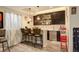 Entertainment area with bar, seating and recreation equipment creating an ideal venue for social gatherings at 15122 Fillmore Way, Thornton, CO 80602