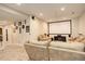 Spacious finished basement with a home theater setup, perfect for entertaining and relaxation at 15122 Fillmore Way, Thornton, CO 80602