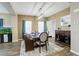 Inviting dining room features stylish decor, elegant furniture, and a view of the outdoor scenery at 15122 Fillmore Way, Thornton, CO 80602