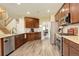 Well-equipped kitchen features stainless steel appliances, granite countertops, and wood cabinets with ample storage at 15122 Fillmore Way, Thornton, CO 80602