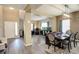 This expansive living area seamlessly integrates a dining space, creating a perfect space for gatherings at 15122 Fillmore Way, Thornton, CO 80602