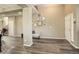 Spacious living area features wood floors, a welcoming entryway, and neutral decor with an inviting ambiance at 15122 Fillmore Way, Thornton, CO 80602