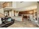 Inviting open-concept living space with kitchen, dining area, and living room, creating a welcoming atmosphere at 15122 Fillmore Way, Thornton, CO 80602