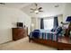 This main bedroom has vaulted ceilings, bright windows with curtains, neutral walls, and an area rug at 15122 Fillmore Way, Thornton, CO 80602