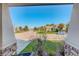 A picturesque neighborhood view from the front porch showcasing lush lawns and various homes at 15122 Fillmore Way, Thornton, CO 80602