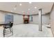 Finished basement features a fireplace, windows, and bar seating at 15901 W 66Th Pl, Arvada, CO 80007