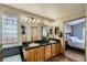 Bright bathroom featuring a tub, shower, double sink vanity and natural light at 15901 W 66Th Pl, Arvada, CO 80007
