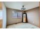 Cozy bedroom with neutral walls, soft carpet, window and stylish lighting at 15901 W 66Th Pl, Arvada, CO 80007