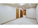 View of bedroom with white carpet, neutral walls, and wood trim doors at 15901 W 66Th Pl, Arvada, CO 80007