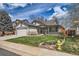 Charming single-Gathering home with manicured lawn and stone accents at 15901 W 66Th Pl, Arvada, CO 80007