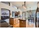 Open kitchen with granite countertops, hardwood floors, and breakfast nook at 15901 W 66Th Pl, Arvada, CO 80007