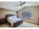 Inviting main bedroom featuring a trey ceiling, large windows, and a cozy carpeted floor at 15901 W 66Th Pl, Arvada, CO 80007