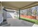 Covered patio with concrete floor, perfect for outdoor relaxation and entertaining at 15901 W 66Th Pl, Arvada, CO 80007