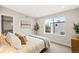 Bright bedroom with large window and neutral color palette at 6242 W 38 Th Ave, Wheat Ridge, CO 80033