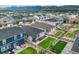 An aerial shot shows homes with fenced yards, well-kept lawns and mountain views at 2130 Indian Balsam Dr, Monument, CO 80132