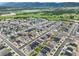 An expansive aerial view shows a Primary-planned community with manicured lawns and scenic surroundings at 2130 Indian Balsam Dr, Monument, CO 80132
