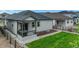 Large backyard with green grass and a charming patio, perfect for outdoor activities at 2130 Indian Balsam Dr, Monument, CO 80132