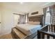 Charming bedroom featuring a barn door entry to the bathroom and a comfortable king-size bed at 2130 Indian Balsam Dr, Monument, CO 80132
