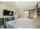 Bright bedroom with a sliding barn door to the bathroom and ample natural light at 2130 Indian Balsam Dr, Monument, CO 80132