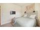 Comfortable bedroom featuring a wall-mounted TV and charming rustic headboard with lamps at 2130 Indian Balsam Dr, Monument, CO 80132