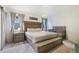 Beautiful bedroom featuring a king bed, bench, and a charming baby crib at 2130 Indian Balsam Dr, Monument, CO 80132