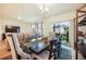 Well-lit dining room showcasing table with seating for six with backyard access at 2130 Indian Balsam Dr, Monument, CO 80132