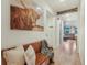 Welcoming hallway featuring wood floors, farmhouse decor, and a view into the living area at 2130 Indian Balsam Dr, Monument, CO 80132