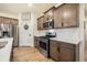 Well-lit kitchen with stainless steel appliances, gas range, and ample cabinet space at 2130 Indian Balsam Dr, Monument, CO 80132