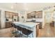 Modern kitchen with a large island perfect for dining, stainless steel fridge, and modern appliances at 2130 Indian Balsam Dr, Monument, CO 80132