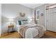 Cozy bedroom with hardwood floors, comfortable bed, and natural light at 639 25Th St, Denver, CO 80205