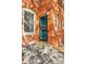Inviting entryway of brick building with a bright blue door and clear address display at 639 25Th St, Denver, CO 80205