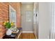 Inviting entryway featuring exposed brick wall and stylish decor at 639 25Th St, Denver, CO 80205
