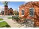 Charming brick building featuring well-maintained landscaping at 639 25Th St, Denver, CO 80205