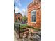 Brick building featuring raised garden beds and a nearby church at 639 25Th St, Denver, CO 80205