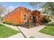 Charming brick home with landscaped front yard and black metal fence at 639 25Th St, Denver, CO 80205