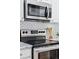 Well-equipped kitchen featuring stainless steel appliances and attractive backsplash design at 639 25Th St, Denver, CO 80205