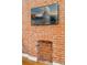 Detailed shot of the brick fireplace, and display TV in living room at 639 25Th St, Denver, CO 80205